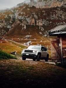 Preview wallpaper jeep, car, front view, rocks