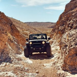 Preview wallpaper jeep, suv, rocks, desert
