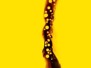Preview wallpaper jet, liquid, air bubbles, pour, aerated, dark, yellow