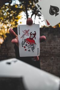 Preview wallpaper joker, card, fingers, hand