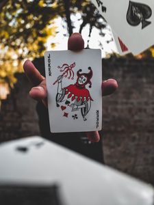 Preview wallpaper joker, card, fingers, hand
