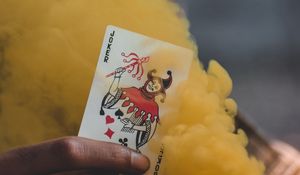 Preview wallpaper joker, playing card, smoke, yellow, hand