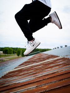 Preview wallpaper jump, legs, sneakers, man, roof
