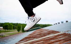 Preview wallpaper jump, legs, sneakers, man, roof