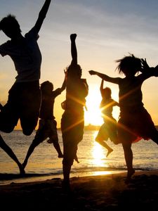 Preview wallpaper jump, people, happiness, light, sunset