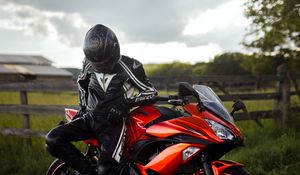 Preview wallpaper kawasaki, motorcycle, motorcyclist, helmet