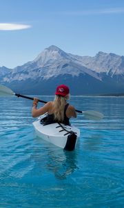 Preview wallpaper kayak, boat, girl, oars, water, mountains