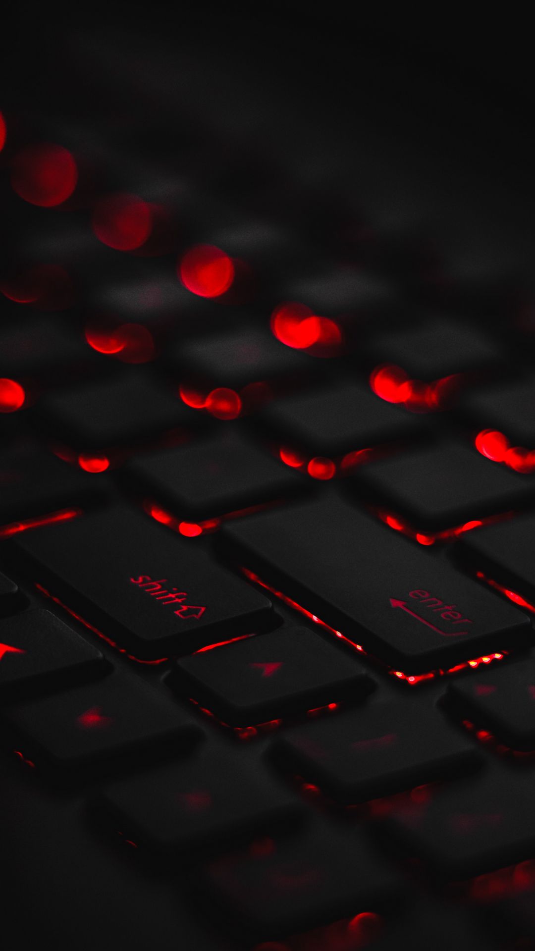 1080x1920 Wallpaper keyboard, backlight, red, glare, bokeh