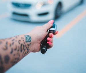 Preview wallpaper keys, hand, tattoo, car, blur