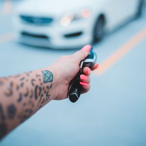 Preview wallpaper keys, hand, tattoo, car, blur