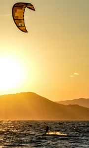 Preview wallpaper kitesurfing, man, sunset, sea, glare