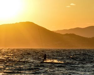 Preview wallpaper kitesurfing, man, sunset, sea, glare