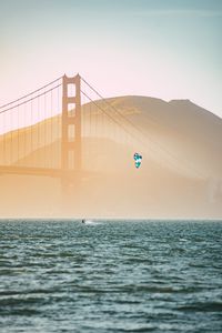 Preview wallpaper kitesurfing, parachute, water, bridge, fog