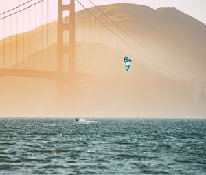 Preview wallpaper kitesurfing, parachute, water, bridge, fog