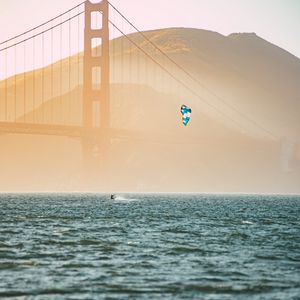 Preview wallpaper kitesurfing, parachute, water, bridge, fog