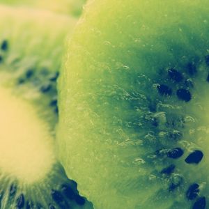 Preview wallpaper kiwi, fruit, slice, bone