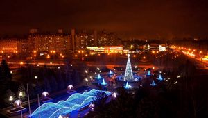 Preview wallpaper krivoy rog, night city, new year, beauty, turquoise, blue, houses, streets, trees, tree, fountain
