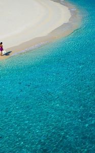 Preview wallpaper lagoon, blue water, beach, coast, girl, hat, sand, resort, rest