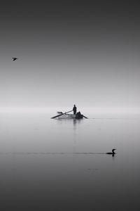 Preview wallpaper lake, boat, calm, horizon, silence, man, birds, bw