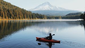 Preview wallpaper lake, boat, man, landscape, nature
