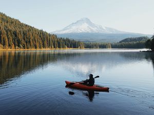 Preview wallpaper lake, boat, man, landscape, nature