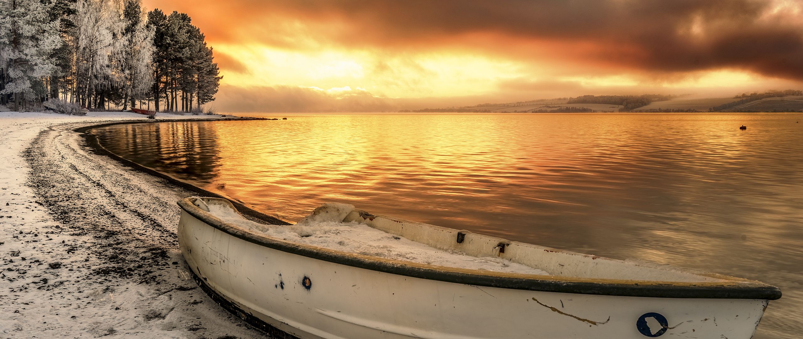 Download wallpaper 2560x1080 lake, boat, shore, sunset, snow, landscape  dual wide 1080p hd background