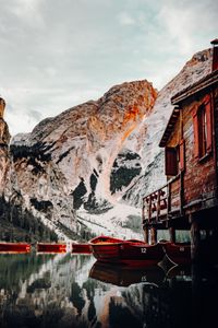 Preview wallpaper lake, boats, pier, mountain, water