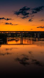 Preview wallpaper lake, bridge, trees, clouds, sky, sunset, dark