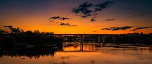 Preview wallpaper lake, bridge, trees, clouds, sky, sunset, dark