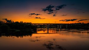 Preview wallpaper lake, bridge, trees, clouds, sky, sunset, dark