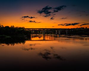 Preview wallpaper lake, bridge, trees, clouds, sky, sunset, dark
