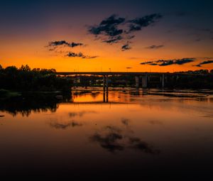 Preview wallpaper lake, bridge, trees, clouds, sky, sunset, dark