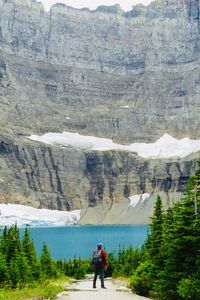 Preview wallpaper lake, cliff, man, nature, travel