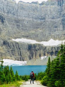 Preview wallpaper lake, cliff, man, nature, travel