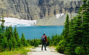 Preview wallpaper lake, cliff, man, nature, travel