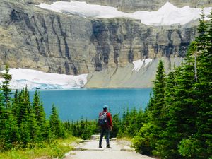 Preview wallpaper lake, cliff, man, nature, travel