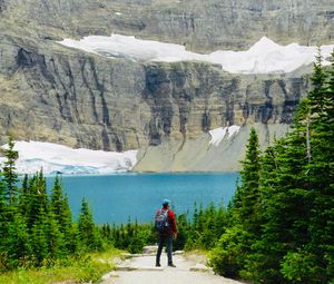 Preview wallpaper lake, cliff, man, nature, travel