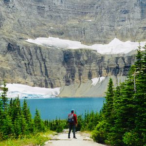 Preview wallpaper lake, cliff, man, nature, travel