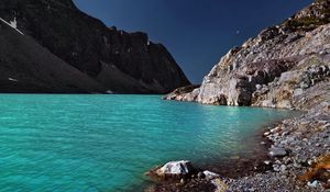 Preview wallpaper lake, coast, azure, stones, pebble, mountains