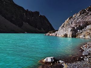 Preview wallpaper lake, coast, azure, stones, pebble, mountains