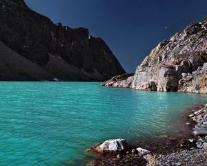 Preview wallpaper lake, coast, azure, stones, pebble, mountains