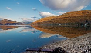 Preview wallpaper lake, coast, board, mountains, reflection, pebble, clearly