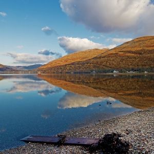 Preview wallpaper lake, coast, board, mountains, reflection, pebble, clearly