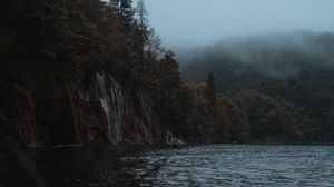 Preview wallpaper lake, coast, cliff, forest, fog