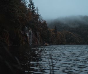 Preview wallpaper lake, coast, cliff, forest, fog