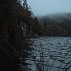 Preview wallpaper lake, coast, cliff, forest, fog