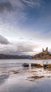 Preview wallpaper lake, coast, stones, sharp, cloudy