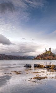 Preview wallpaper lake, coast, stones, sharp, cloudy