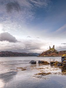 Preview wallpaper lake, coast, stones, sharp, cloudy