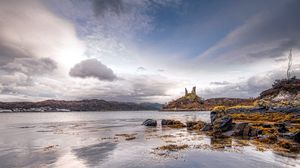 Preview wallpaper lake, coast, stones, sharp, cloudy